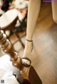 A close up of a woman's feet on a bed.